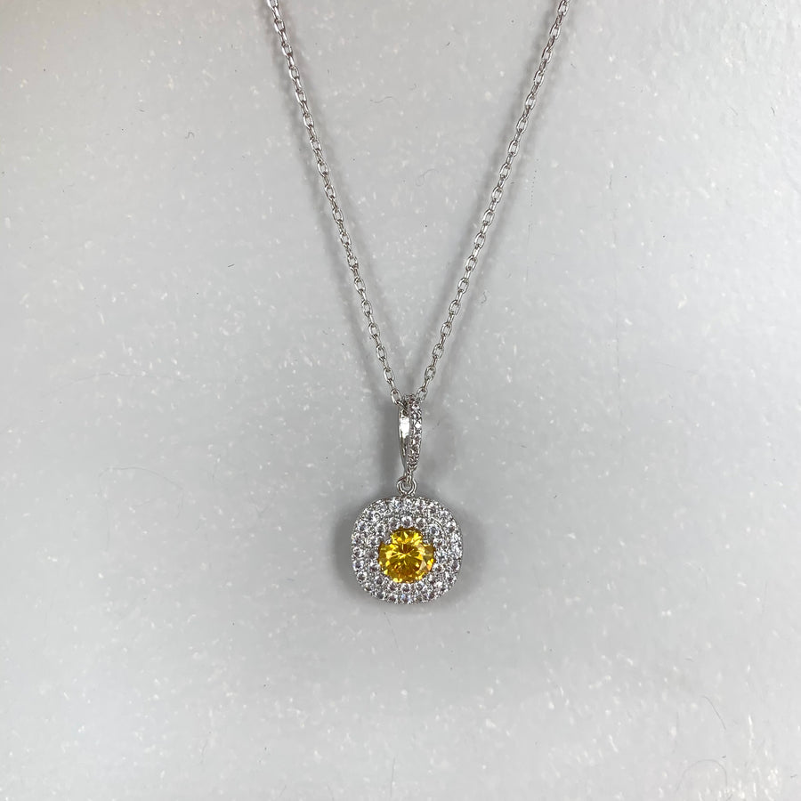 Pendant with citrine centre and double crystal surround